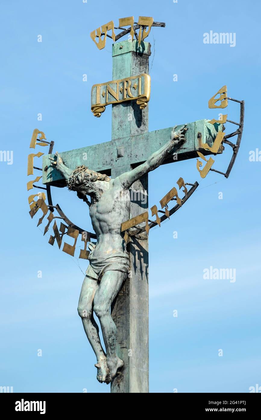 Statuary of St Cross - Calvary on Charles Bridge in Prague Stock Photo