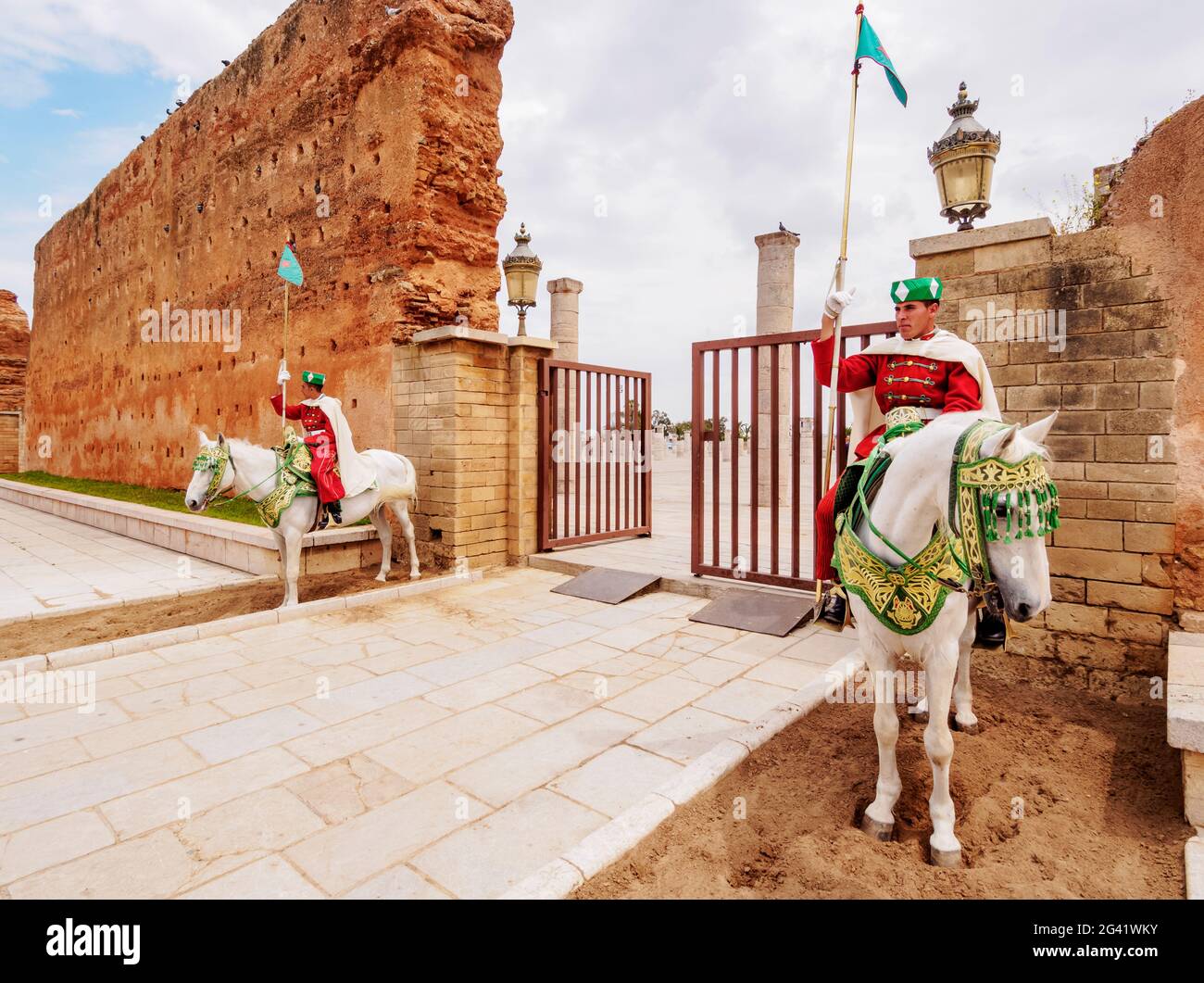 Royal guards on horses in front of the Hassan Tower and Mausoleum of Mohammed V, Rabat, Rabat-Sale-Kenitra Region, Morocco Stock Photo