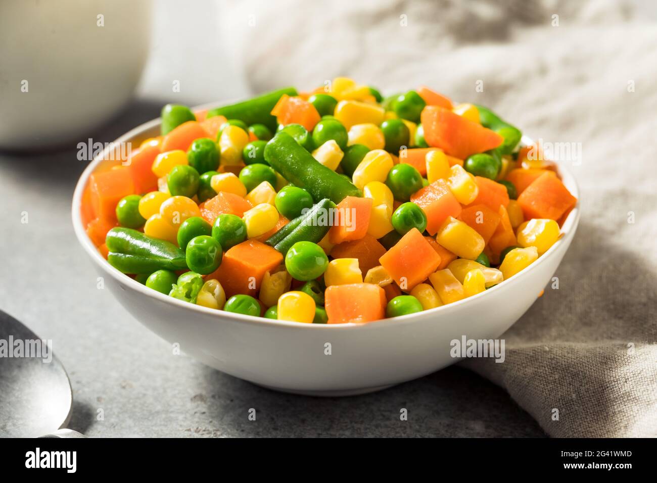 Healthy Steamed Mixed Vegetables with Peas Corns and Carrots Stock