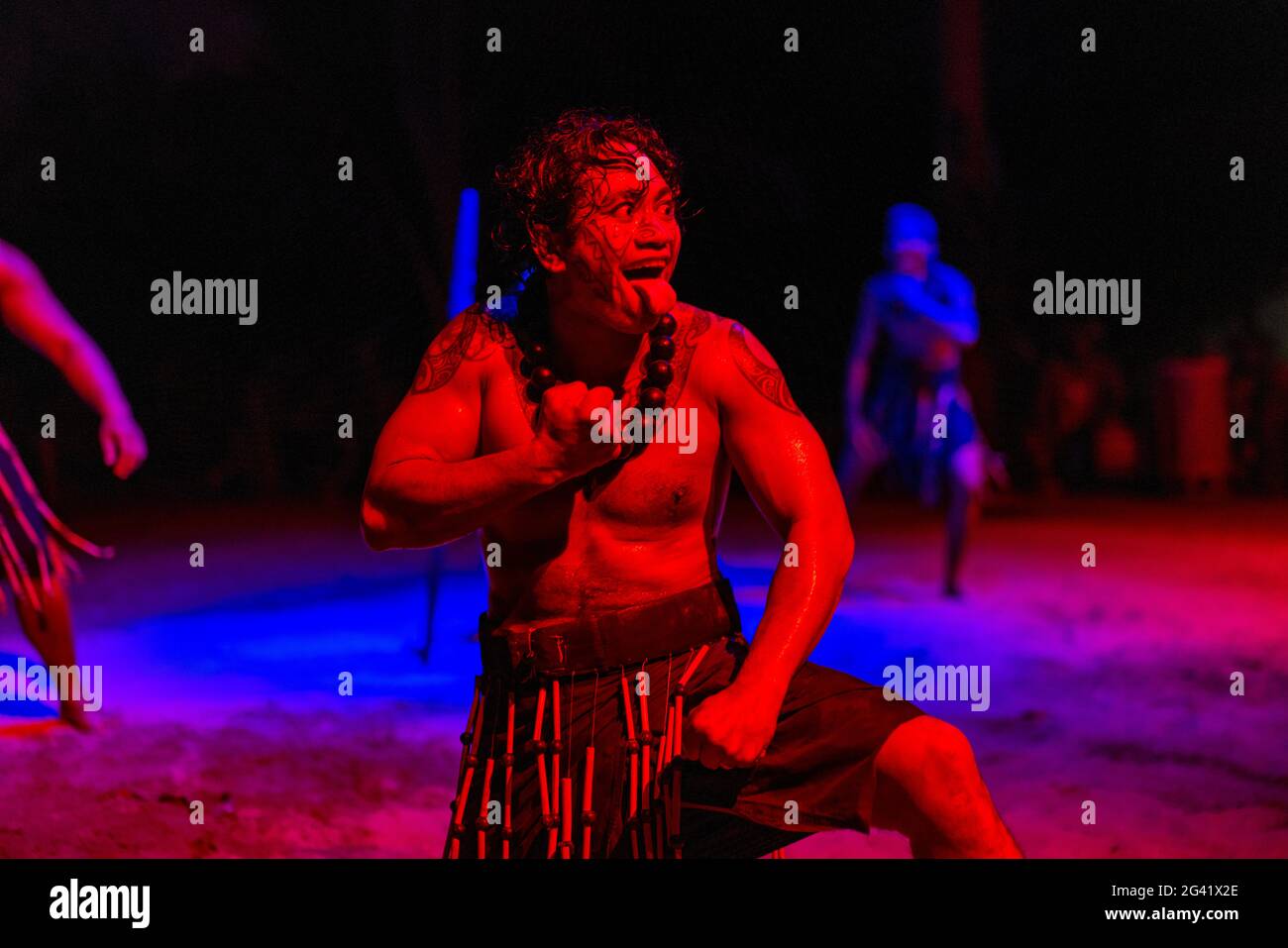 Haka dance performance during the 'Pacifica' show at the Tiki Village cultural center, Moorea, Windward Islands, French Polynesia, South Pacific Stock Photo