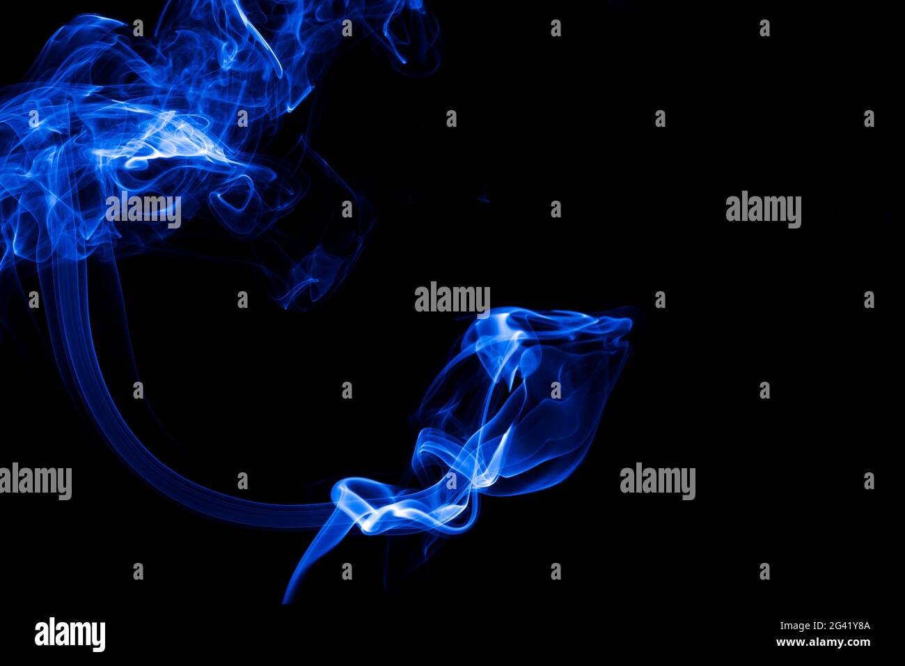 Blue smoke on black background Stock Photo