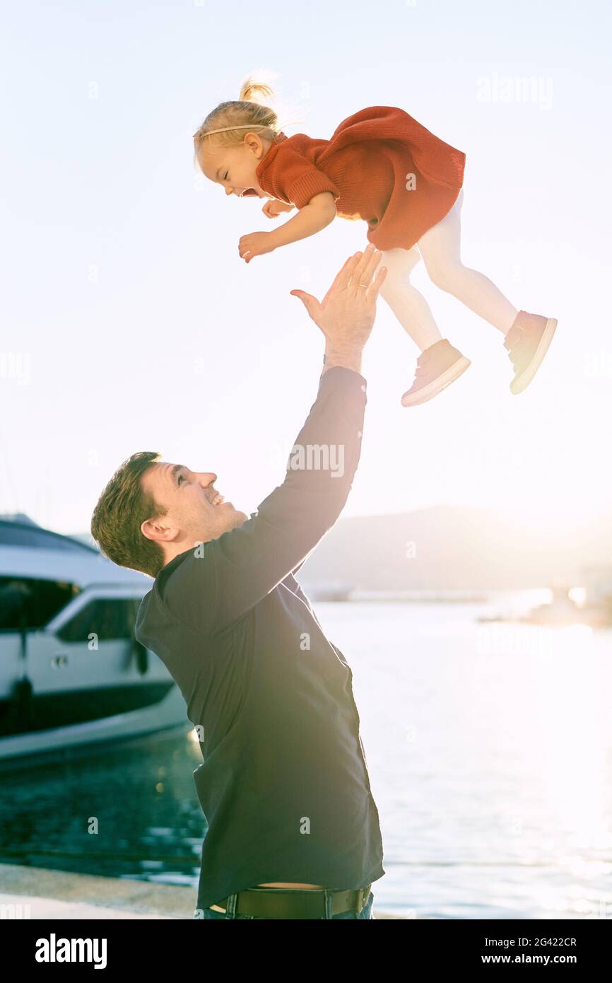 Dad throwing daughter in air hires stock photography and images Alamy