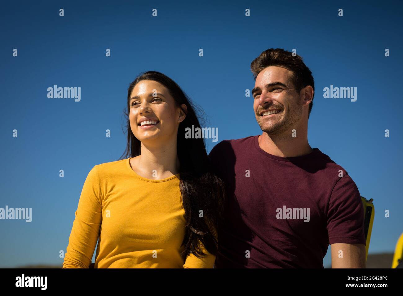 Portrait of happy caucasian couple smiling clear sky Stock Photo - Alamy