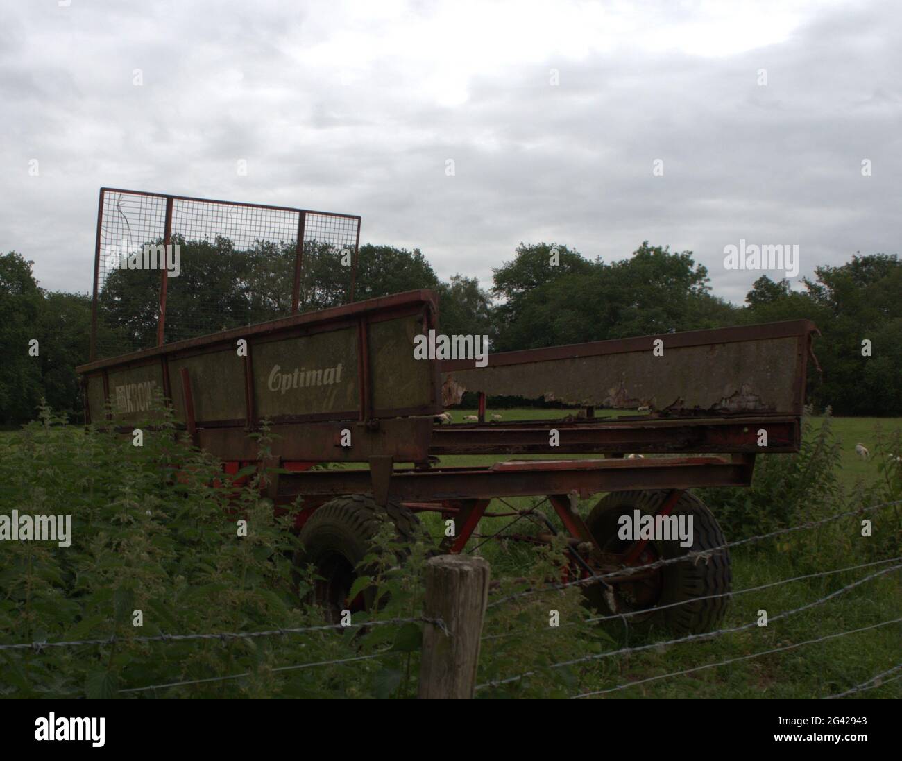 Krone Red Trailer left abandoned in a field in the Cheshire Countryside Stock Photo