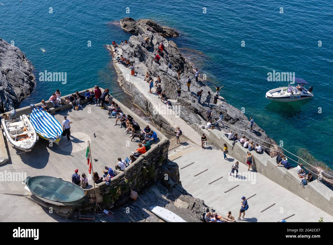 MANAROLA, LIGURIA/ITALY  - APRIL 20 : People enjoying the rocks at Manarola Liguria Italy on April 20, 2019. Unidentified people Stock Photo