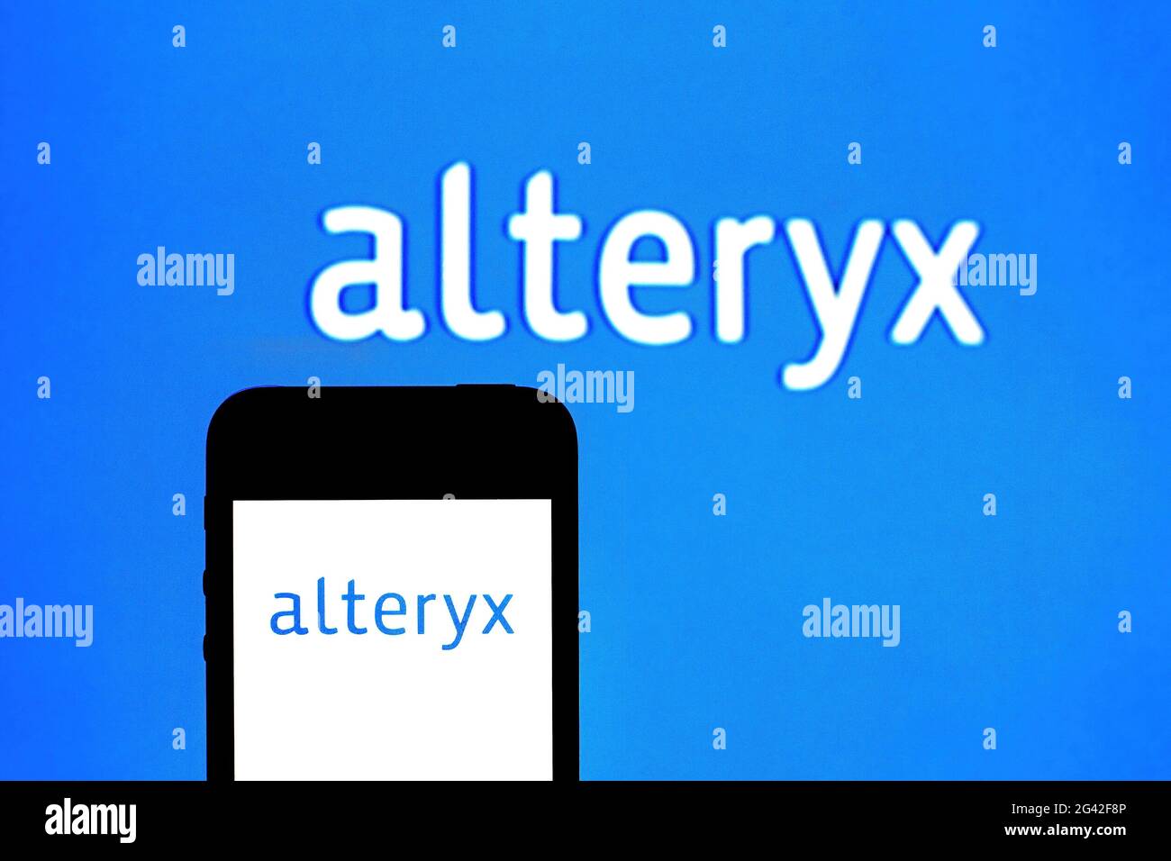 In this photo illustration an Alteryx logo seen displayed on a smartphone with a Alteryx logo in the background. (Photo by Thiago Prudencio / SOPA Images/Sipa USA) Stock Photo