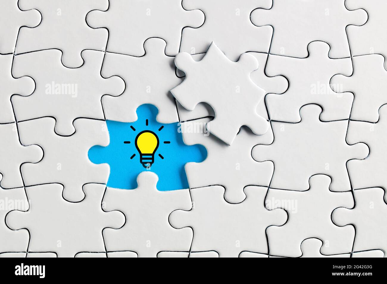 Idea or creativity light bulb icon on the missing puzzle piece. To find a  creative solution concept Stock Photo - Alamy