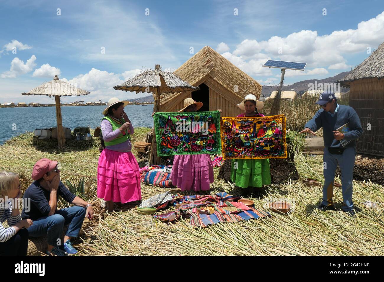 Lake and straw houses Lake Titicaca Peru sell selling goods reed island
