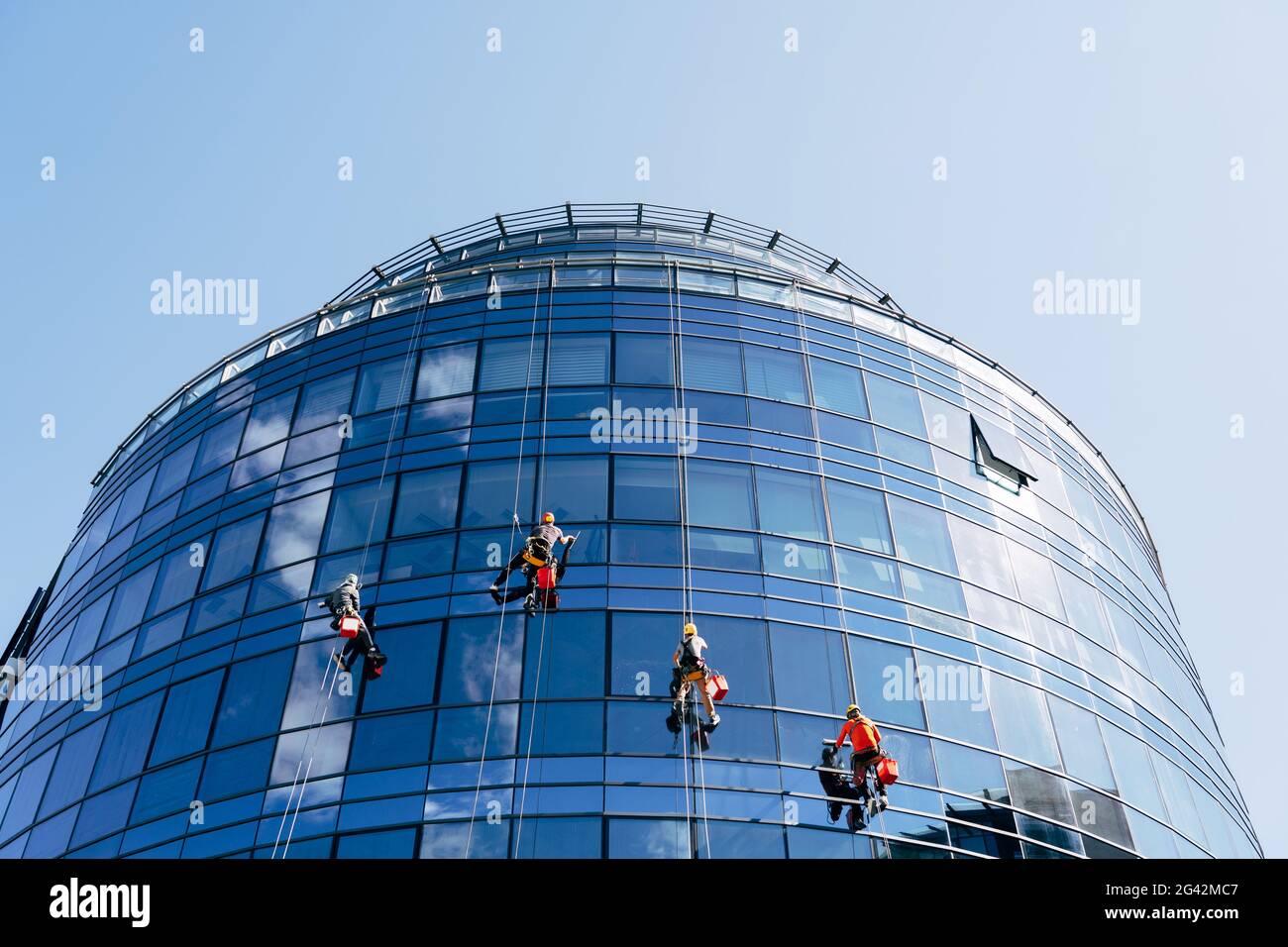 Window cleaners wash blue mirrored windows outside the building Stock Photo Alamy Window cleaners wash blue mirrored windows outside the building Stock Photo Alamy