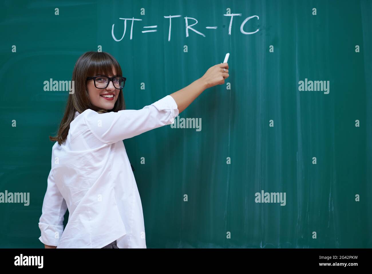 The professor explains the task on the board Stock Photo