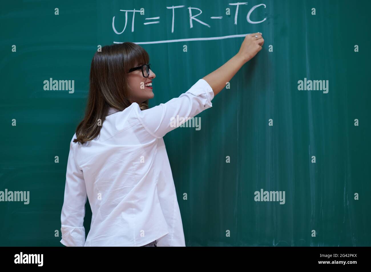 The professor explains the task on the board Stock Photo