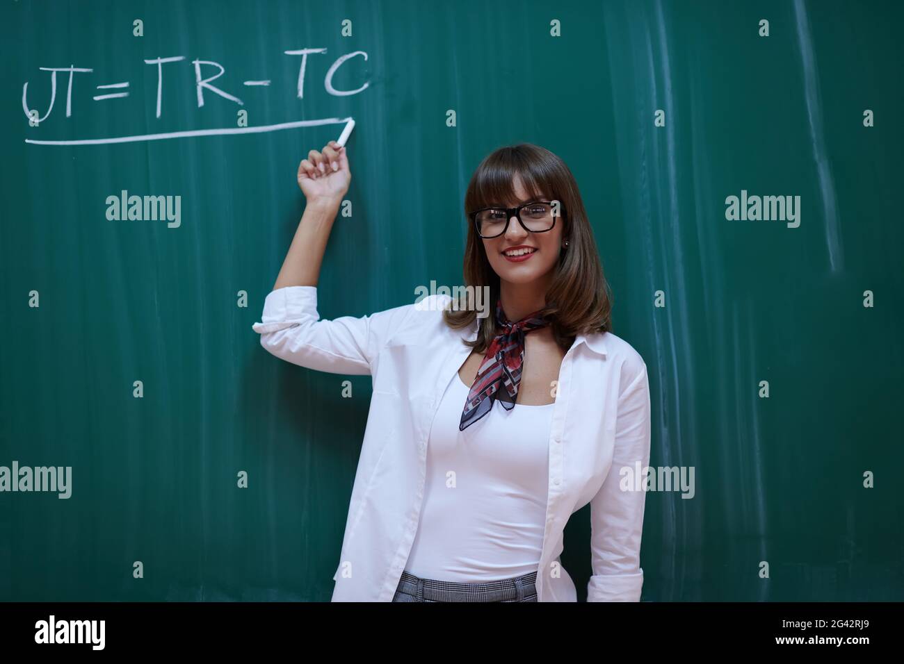 The professor explains the task on the board Stock Photo