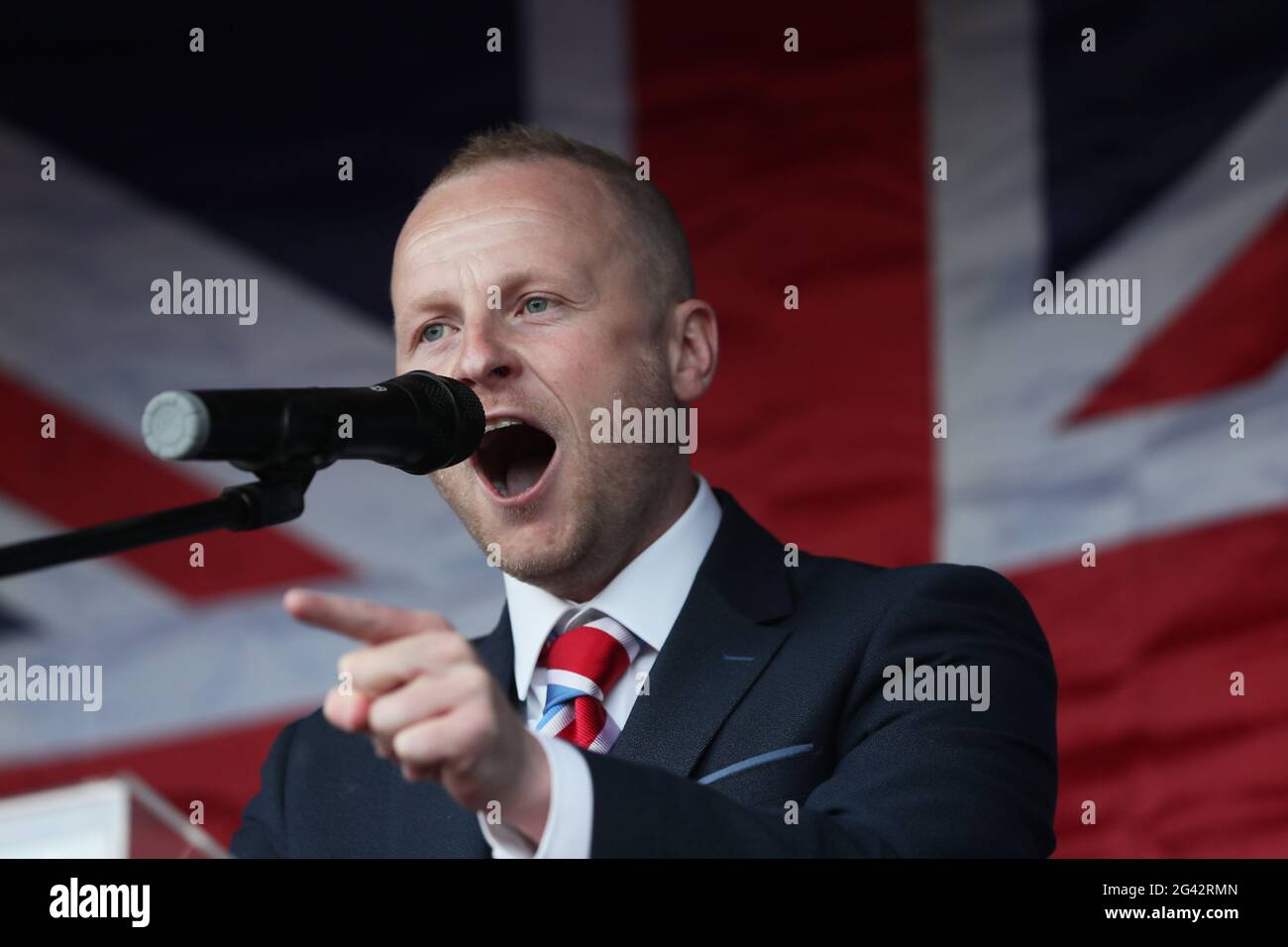 Loyalist blogger Jamie Bryson speaks at a Loyalist protest in Newtownards, County Down, against the Northern Ireland Protocol. Picture date: Friday June 18, 2021. Stock Photo