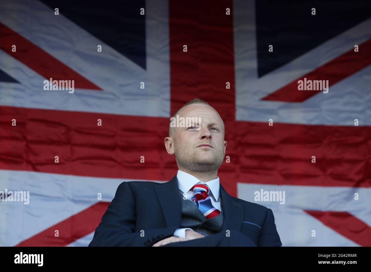 Loyalist blogger Jamie Bryson speaks at a Loyalist protest in Newtownards, County Down, against the Northern Ireland Protocol. Picture date: Friday June 18, 2021. Stock Photo