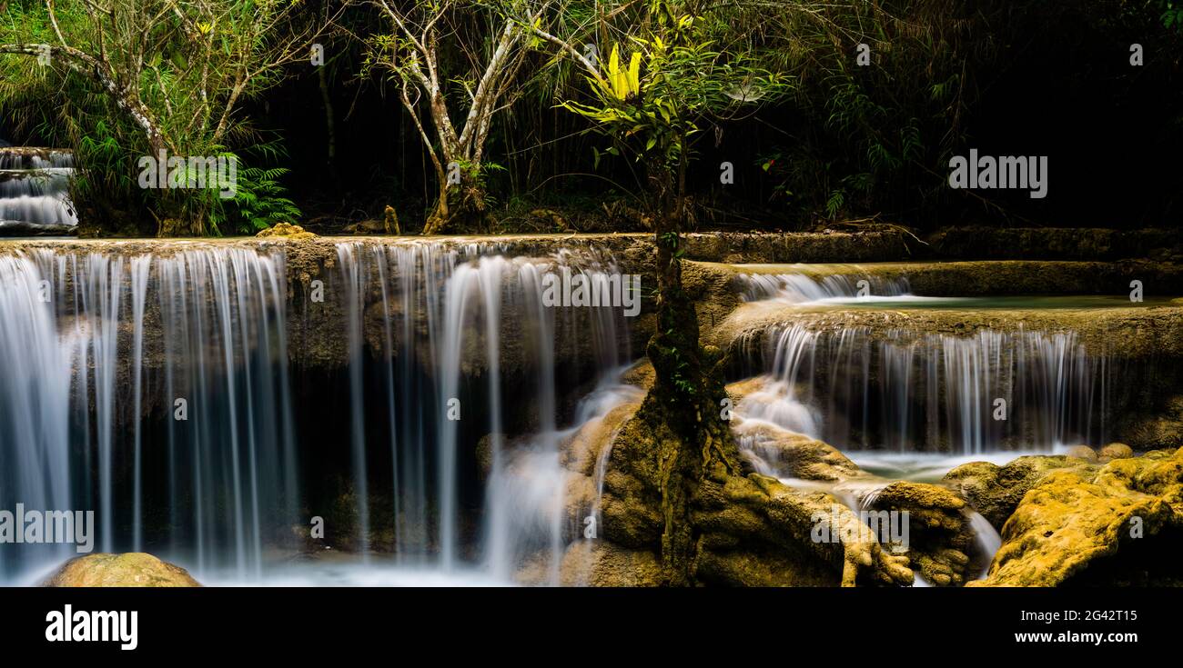 Scenic waterfall in Kuang Si Waterfall Park near Luang Prabang, Laos Stock Photo