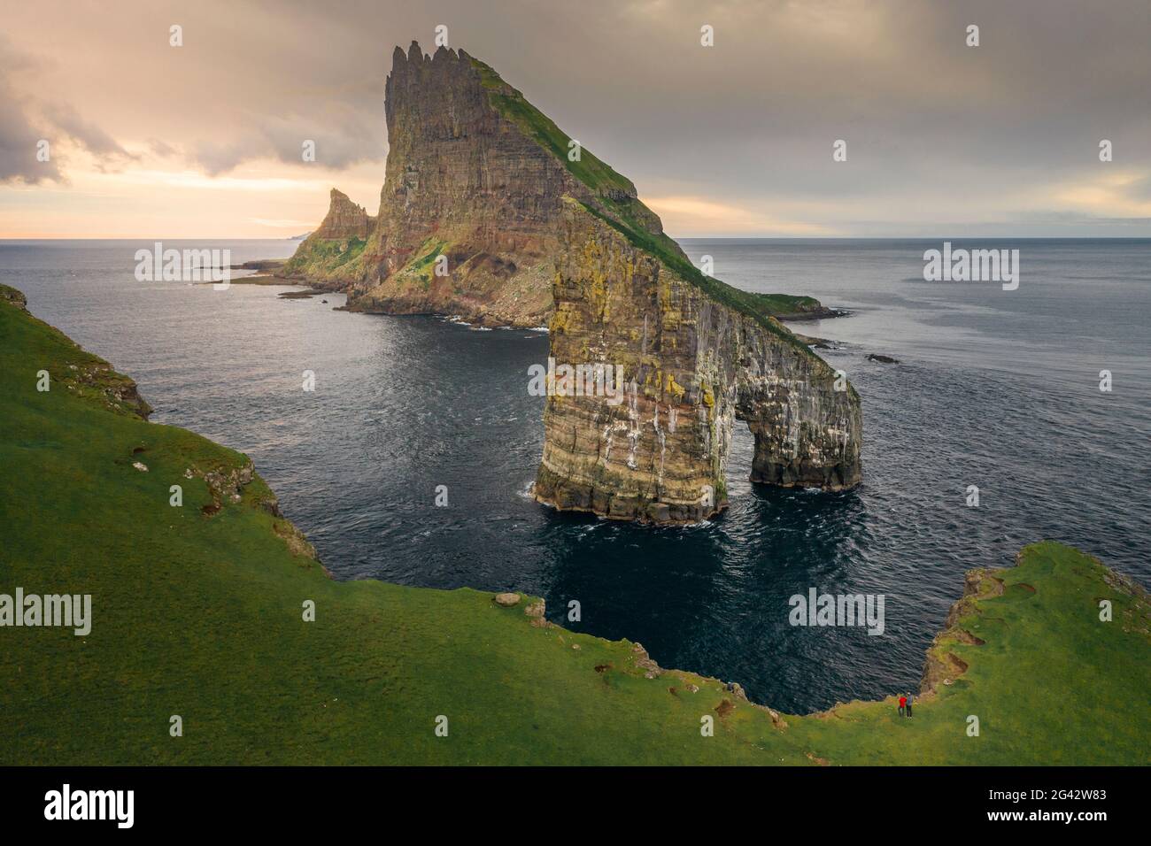 Drangarnier rock formations and Tindholmur island in sunset on Vagar ...