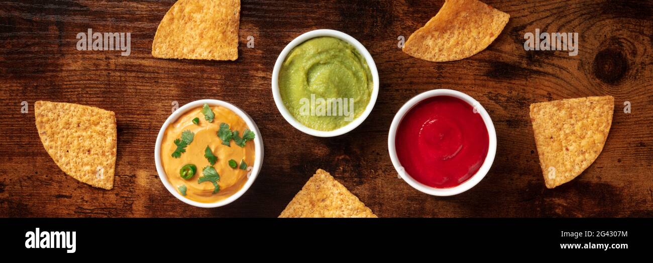 Nacho chips and dips panorama, top shot Stock Photo