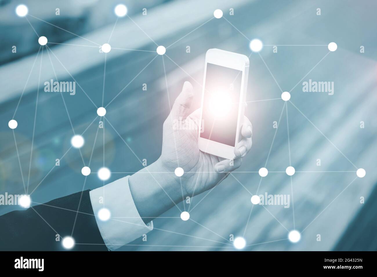 Businessman on blurred background using digital data network wit Stock Photo