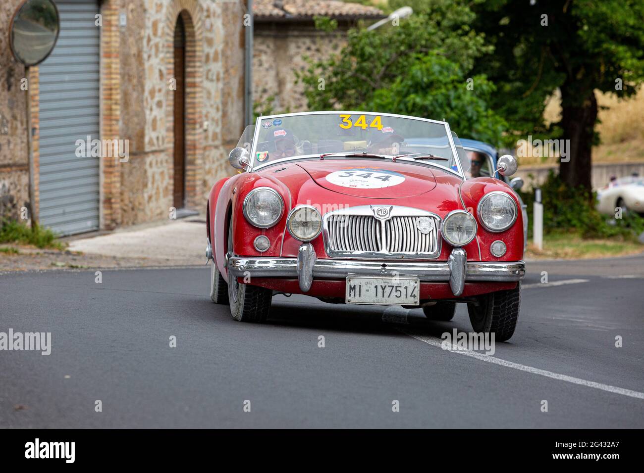 Orvieto, Italy. 18th June, 2021. Cars competing in the Mille Miglia classic car rally pass through Orvieto in Umbria on the third stage from Rome to Bologna. The thousand mile rally recreates the original which ran from 1926 to 1957. Credit: Stephen Bisgrove/Alamy Live News Stock Photo