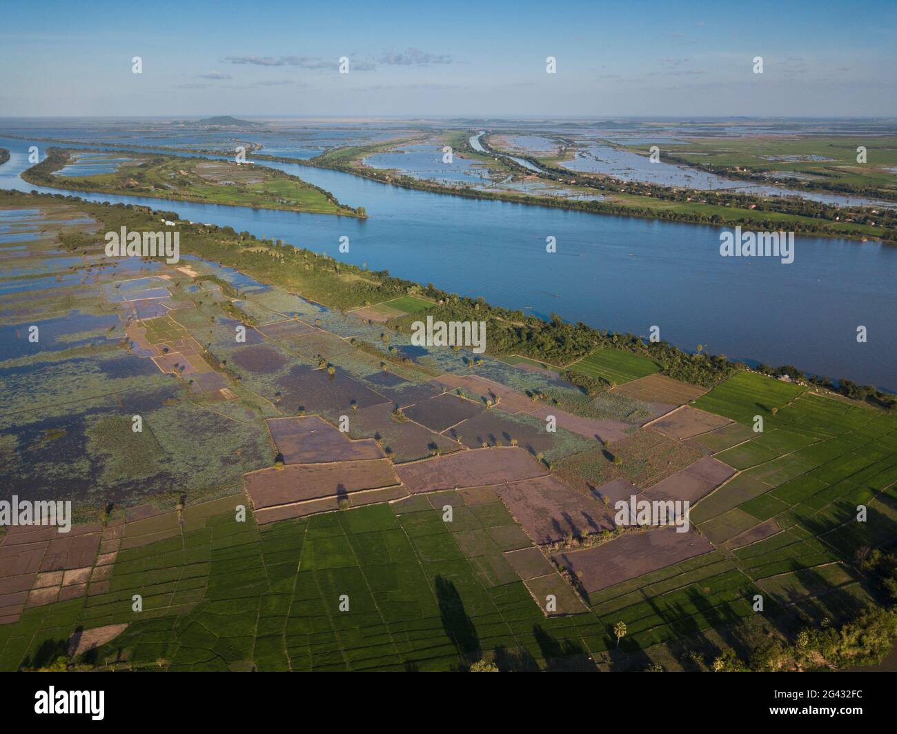 Aerial view of Tonle Sap River, village and rice fields, Kampong Prasat ...