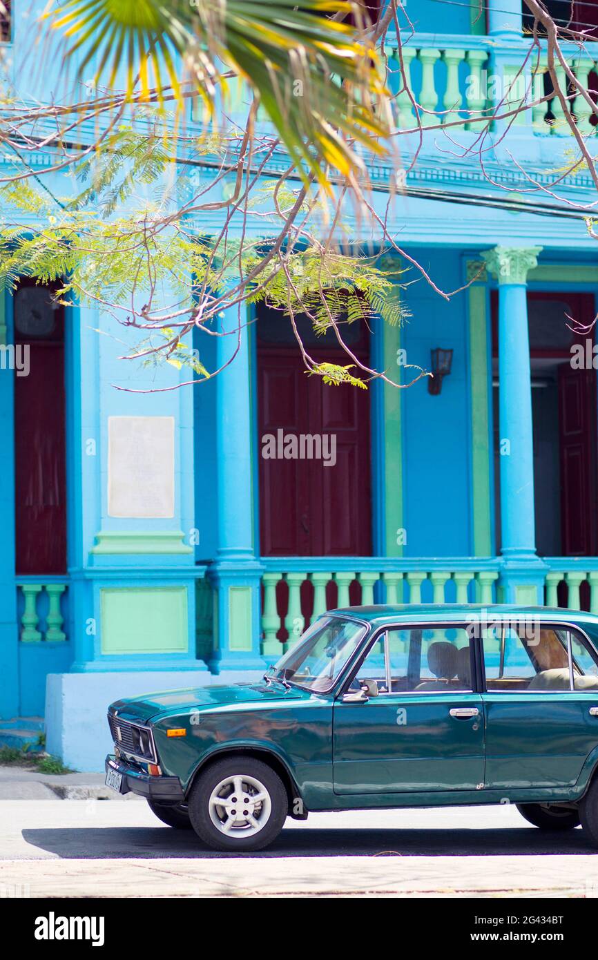 Classics car in front of a blue building in Pinar del Rio, Cuba Stock Photo
