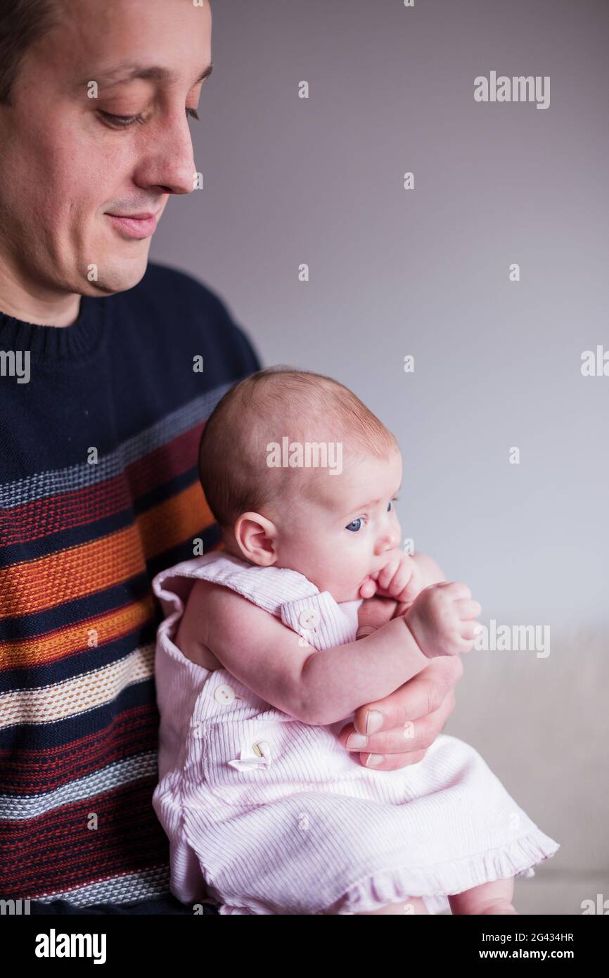 Slav father with a baby.Dad Care Firstborn with love hugging in a candid way. Bulgarian Family together. Fathers day Stock Photo