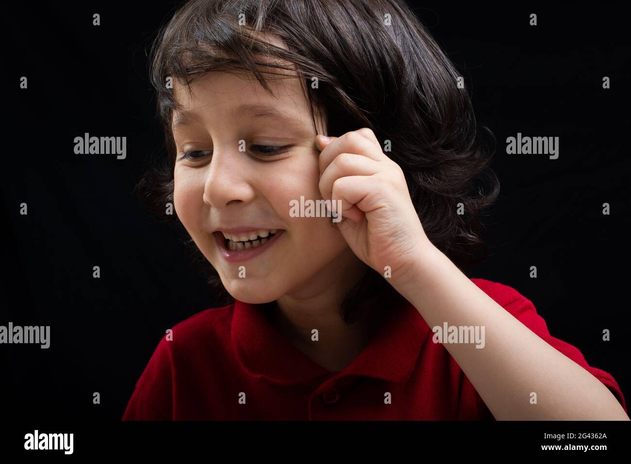 Portrait of a cute happy smiling boy in good mood Stock Photo