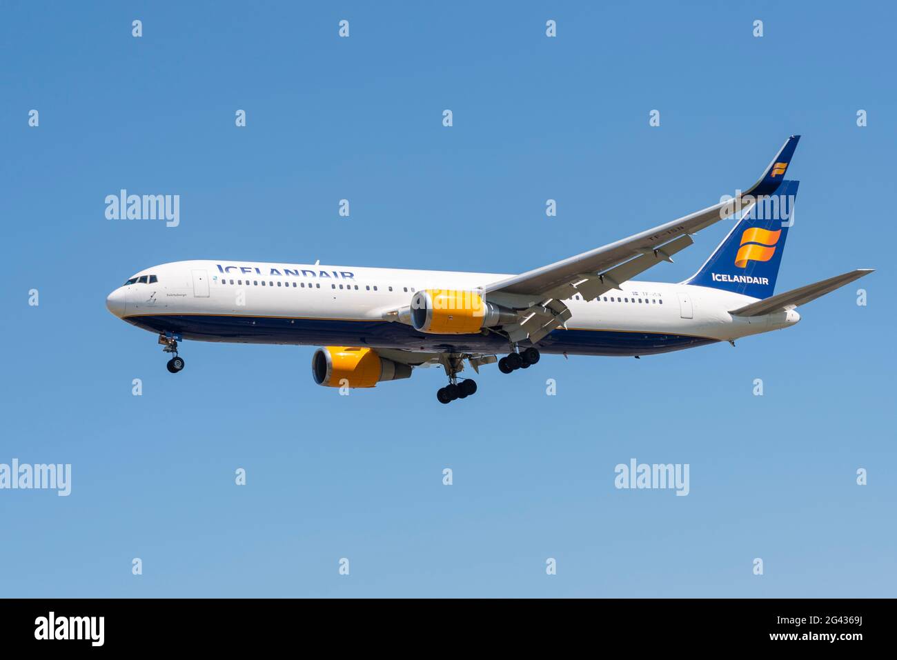 Icelandair Boeing 767 jet airliner plane TF-ISN landing at London Heathrow Airport, UK, in blue sky during COVID 19. Leased from GECAS Stock Photo