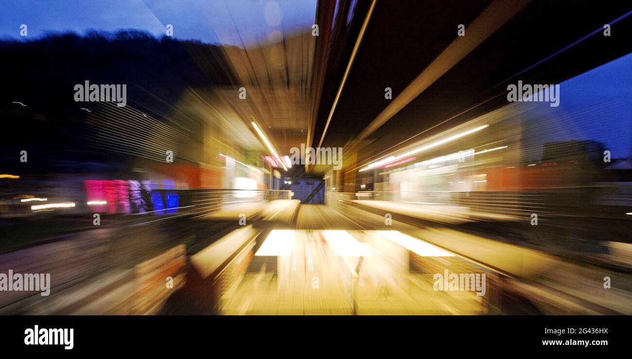 Colorful, semi-abstract traces of movement of a moving suspension railway, Wuppertal, Germany Stock Photo
