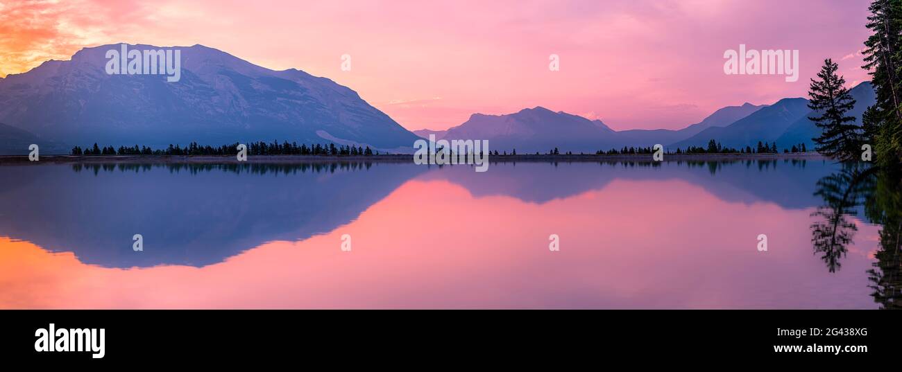 Landscape with Rundle Forebay Reservoir and mountains at sunset