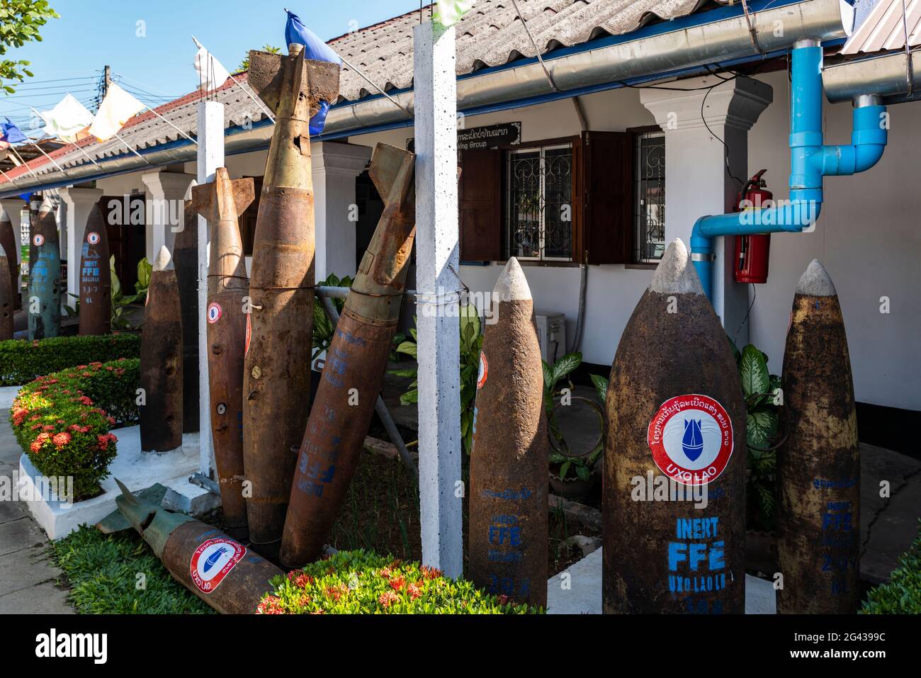 Cartridge casings from unexploded ordnance that fell on Laos during the 2nd Indochina War in the 1970s are exhibited in front of the UXO Laos Informat Stock Photo