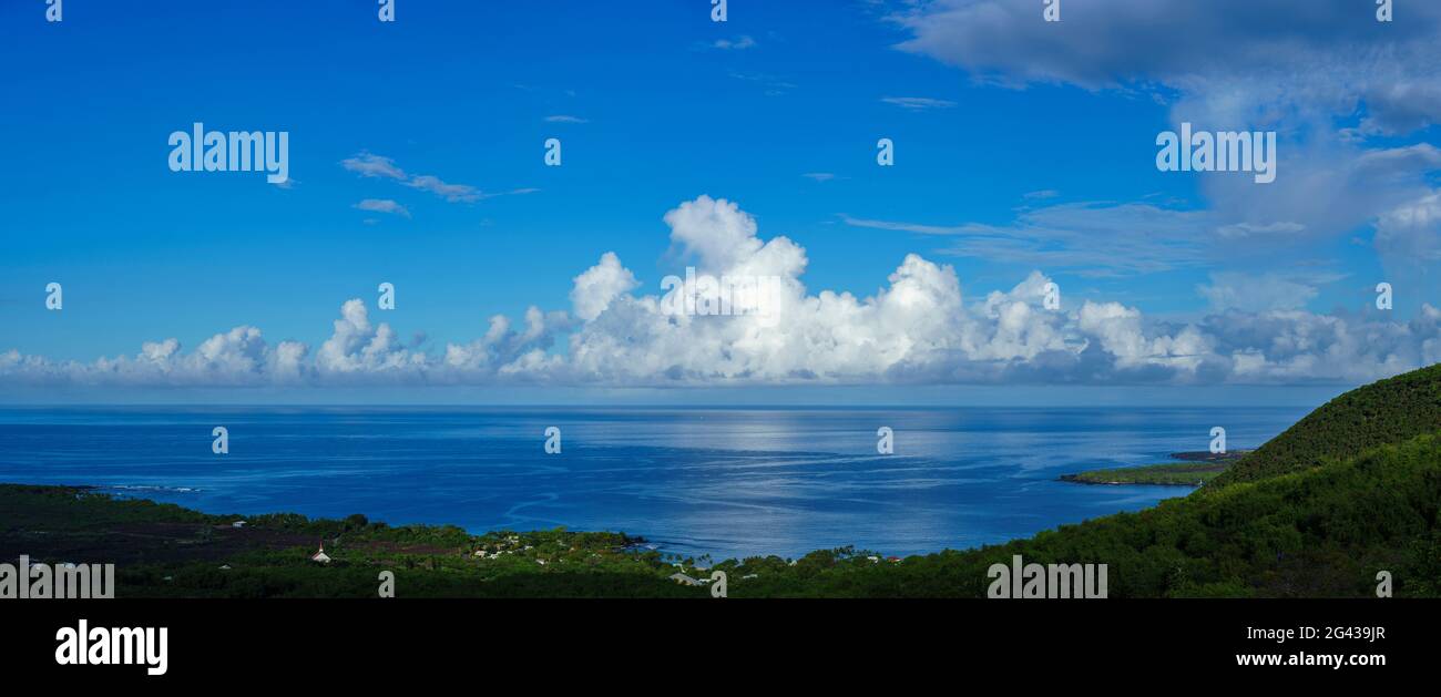 Cumulus cloud and blue sky above Pacific Ocean coastline, South Kona District, Hawaii Islands, USA Stock Photo