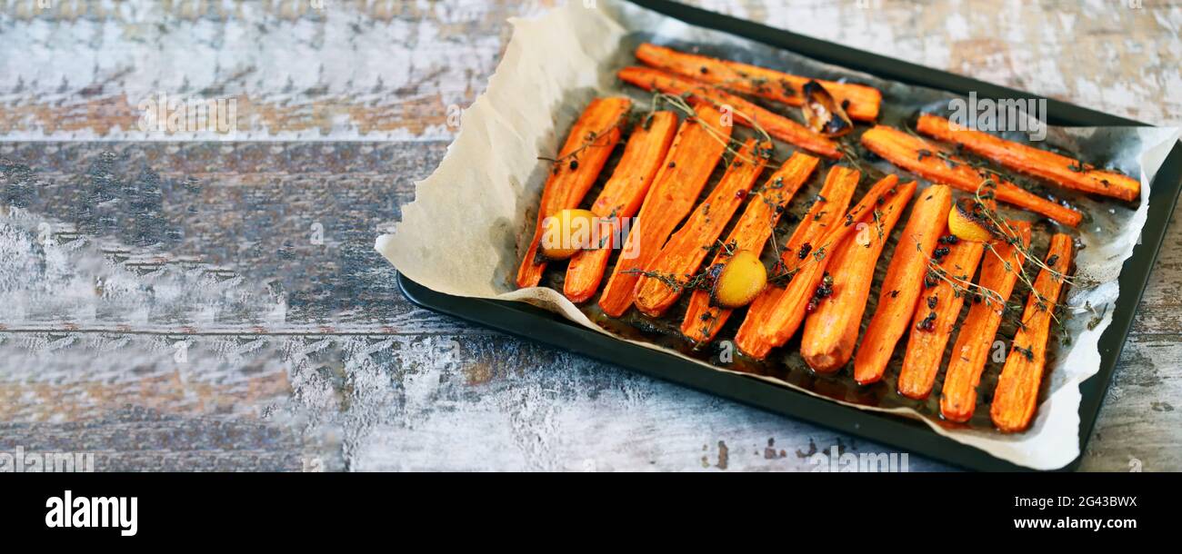 Baked carrots with herbs and spices Stock Photo Alamy