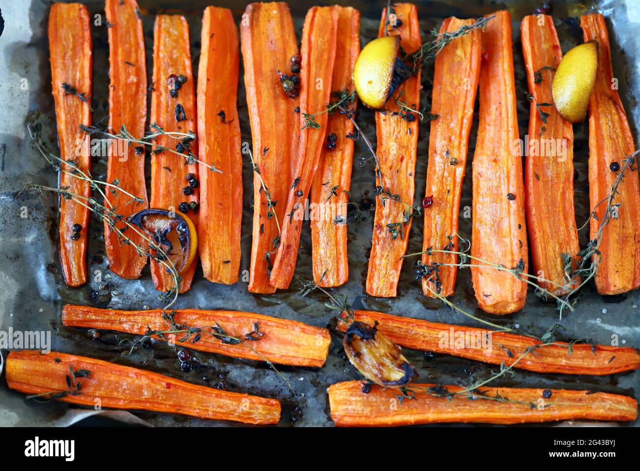 Baked carrots with herbs and spices Stock Photo Alamy