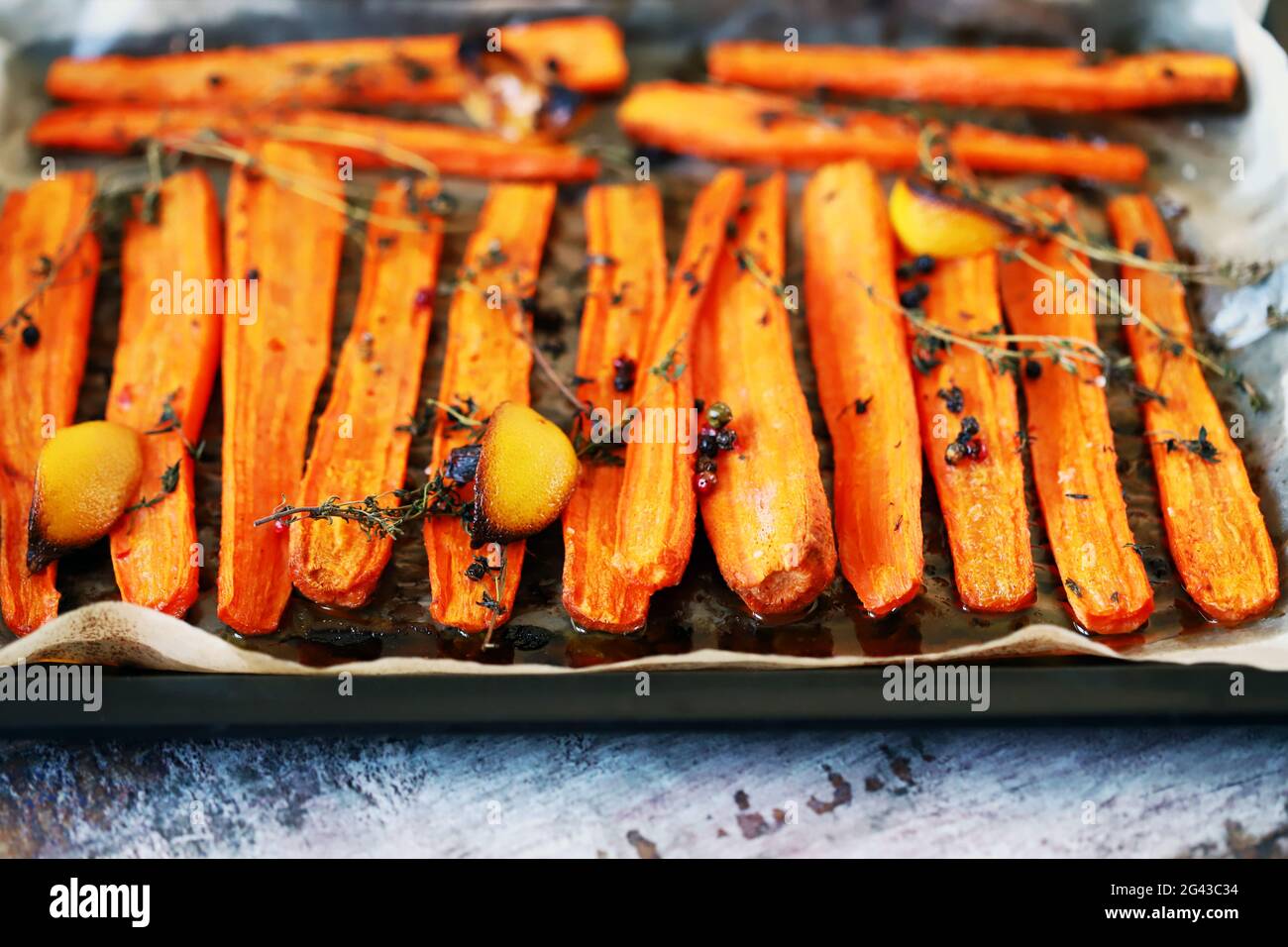Baked carrots with herbs and spices Stock Photo Alamy