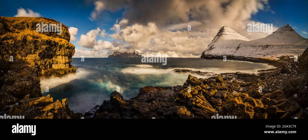 Landscape with rocky coastline and Kalsoy Island, Faroe Islands, Denmark Stock Photo