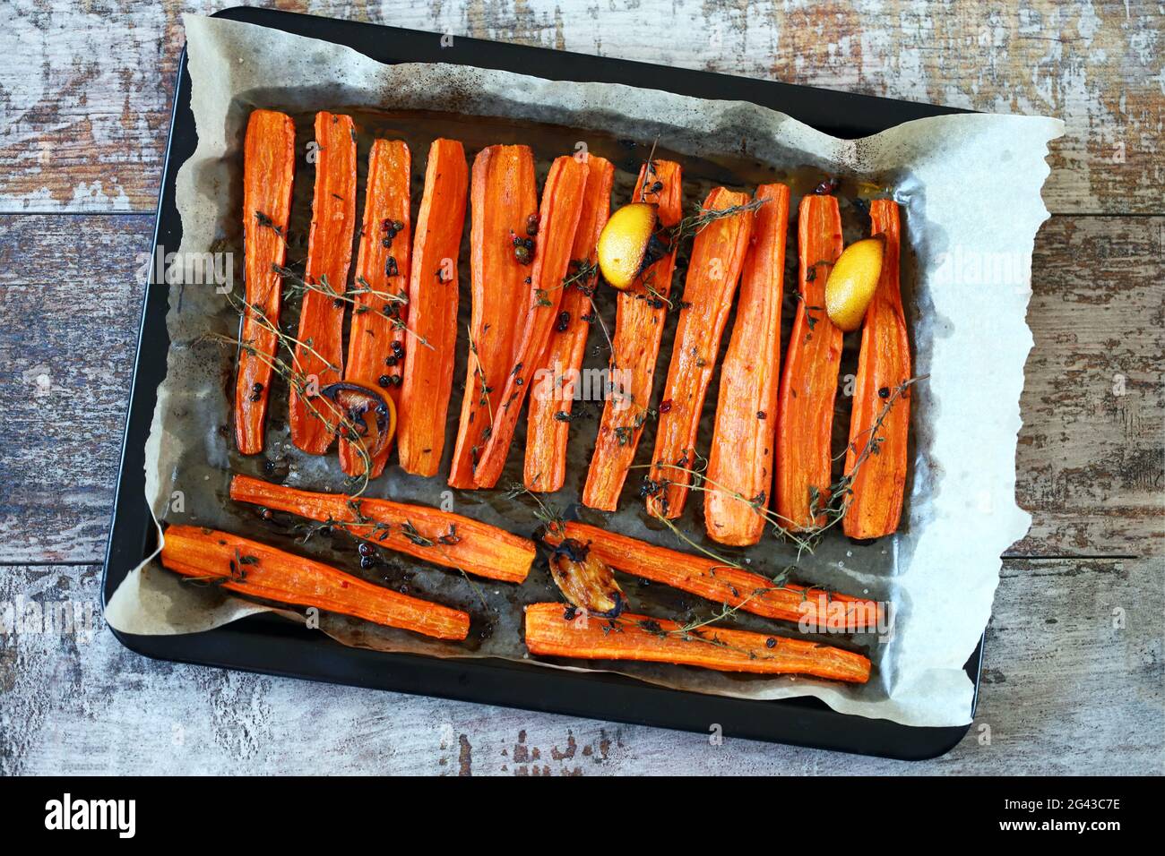 Baked carrots with herbs and spices Stock Photo Alamy