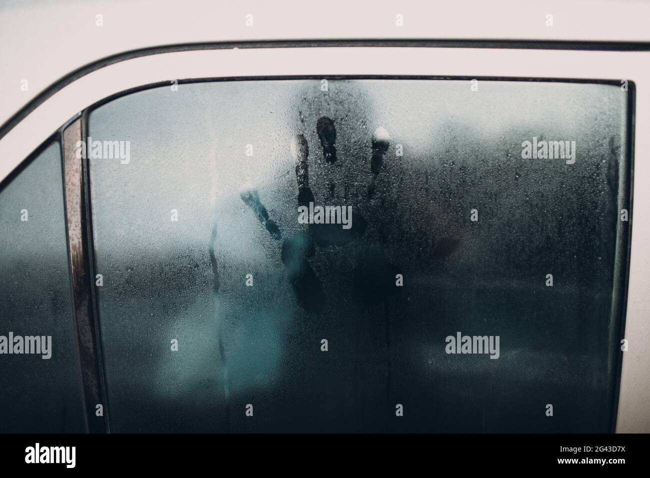 Rain and hand print on glass of car Stock Photo Alamy