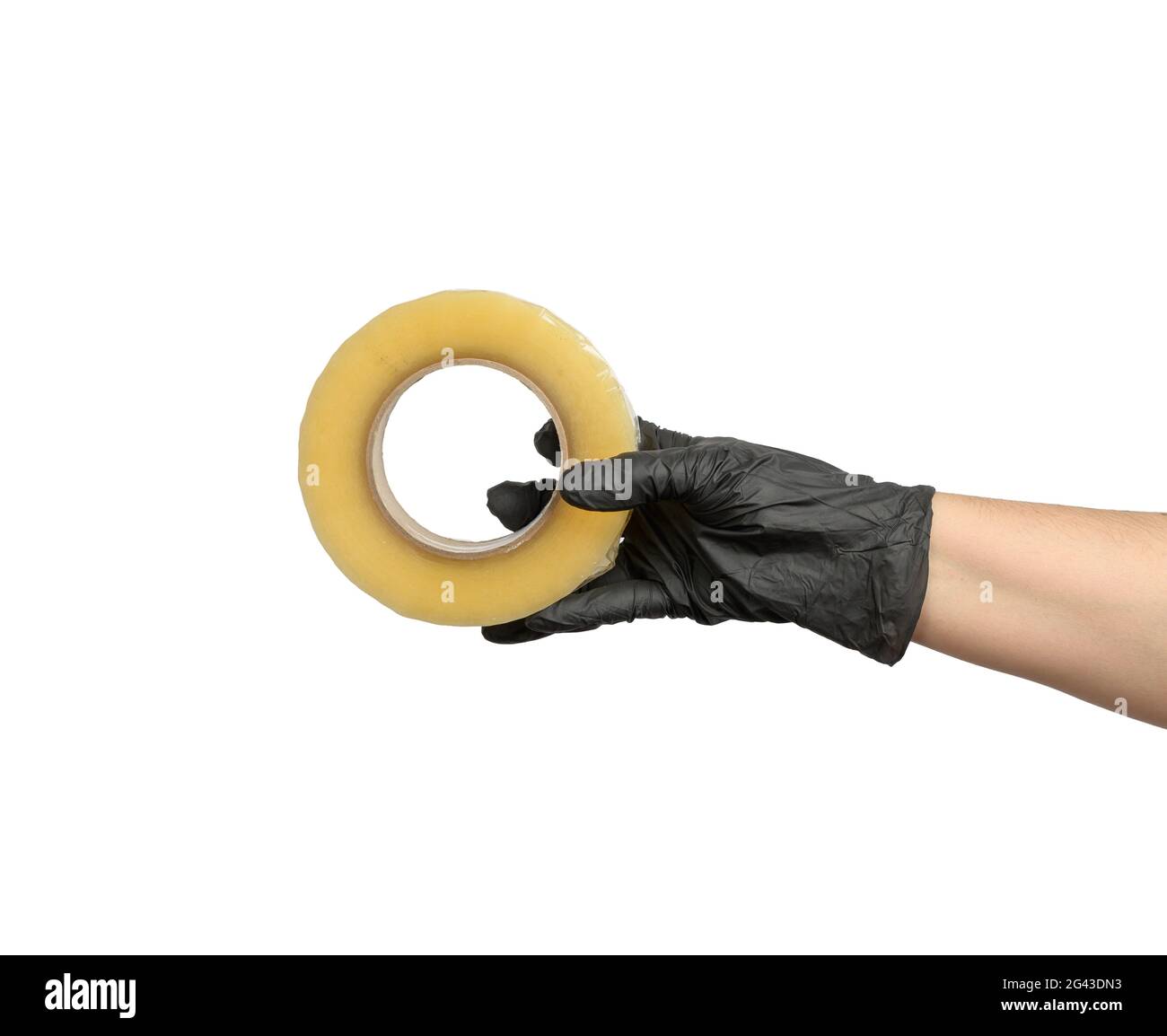 Female hand in black latex glove holds roll of transparent  tape Stock Photo