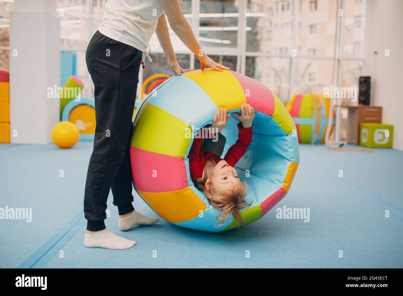 Kids playing in gym at kindergarten or elementary school. Children sport and fitness concept. Stock Photo