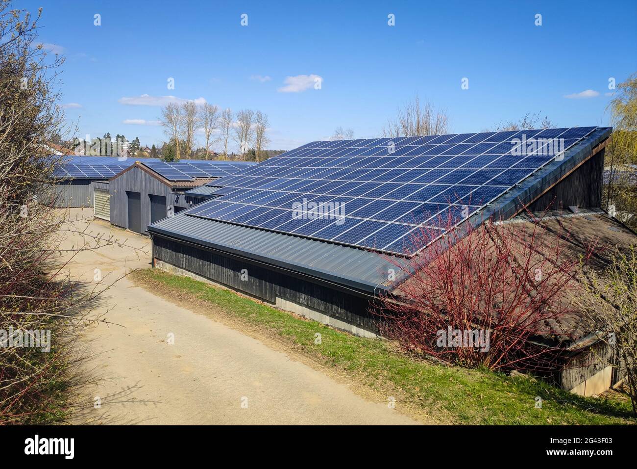 Farm with solar plant on the roof Stock Photo