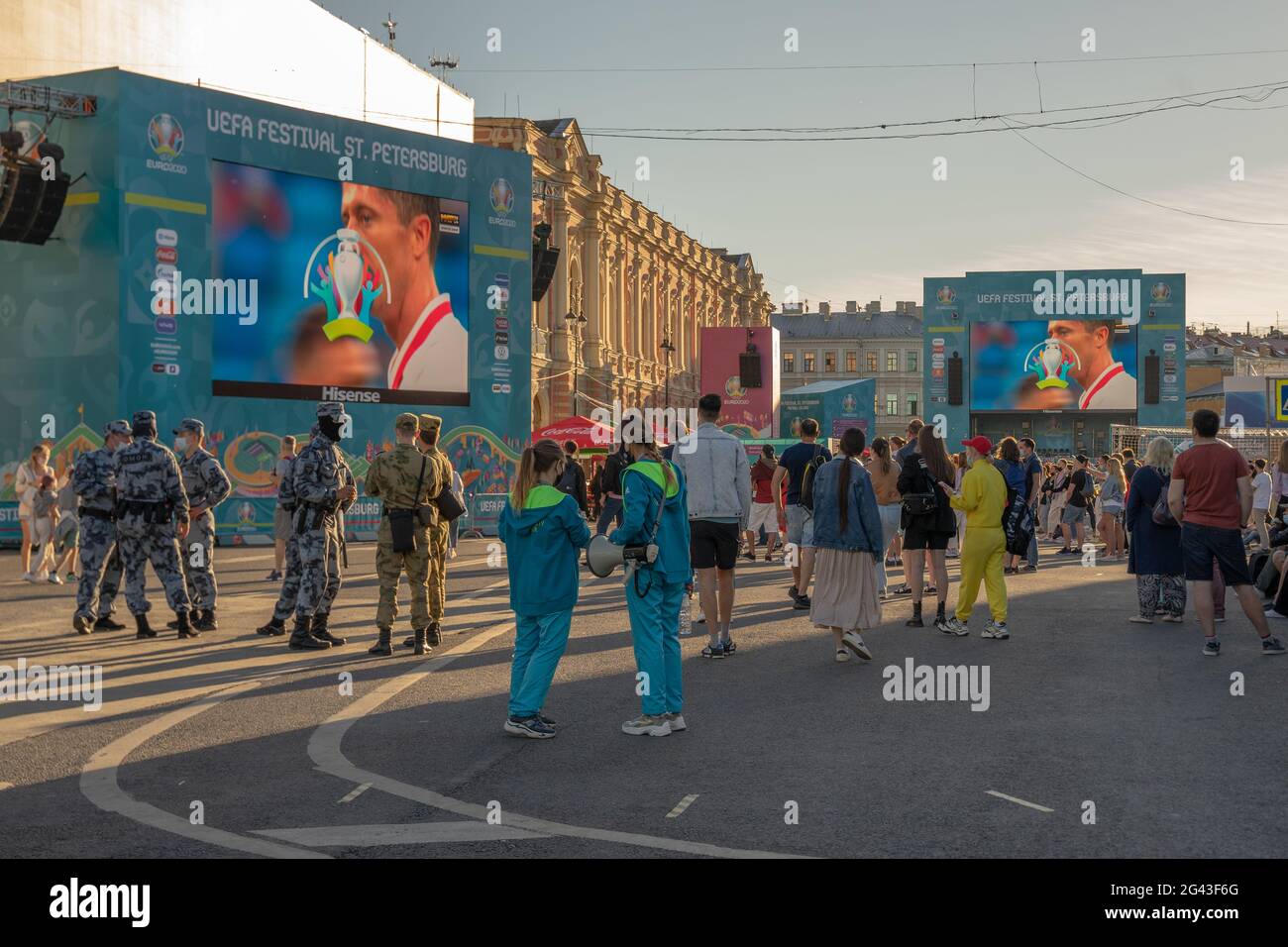 Big outdoor screens showing football game set up in fan zone in historic center of St Petersburg, Russia Stock Photo