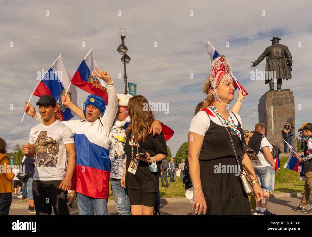 Fans of Russian football, soccer team dressed up in national costumes, fur ear-flap caps, celebrate victory in game, St Petersburg, Russia Stock Photo