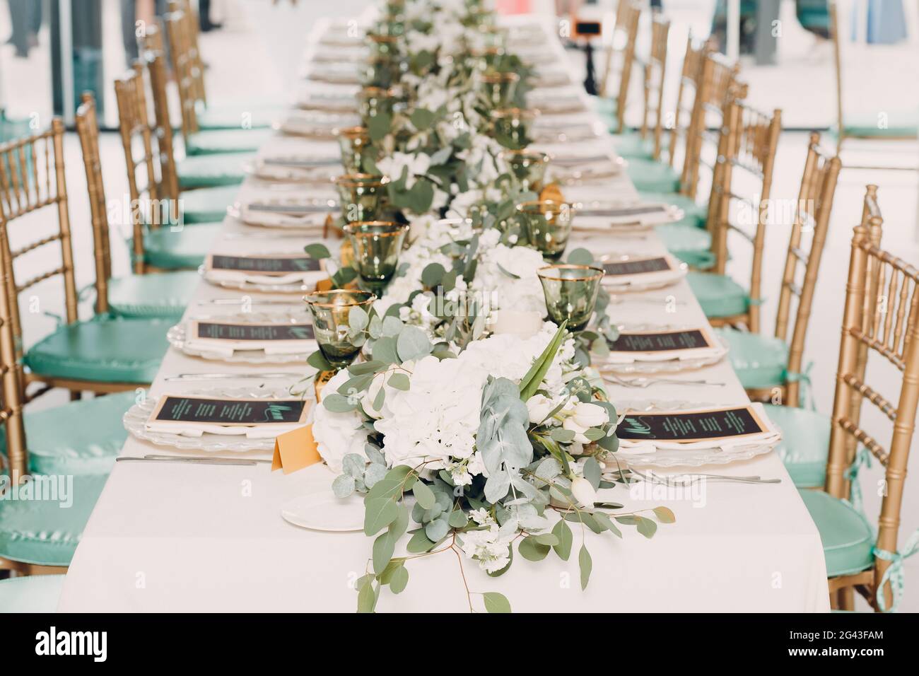 Wedding table setting decor with white flowers Stock Photo