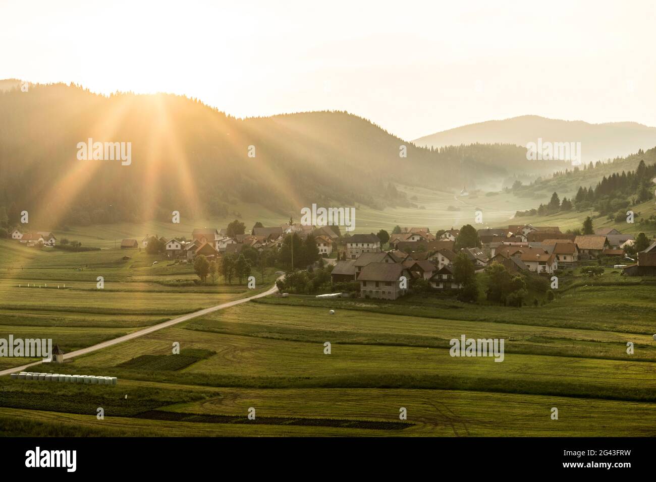 Sunset over the southern Slovenian village of Retje, Loški Potok ...