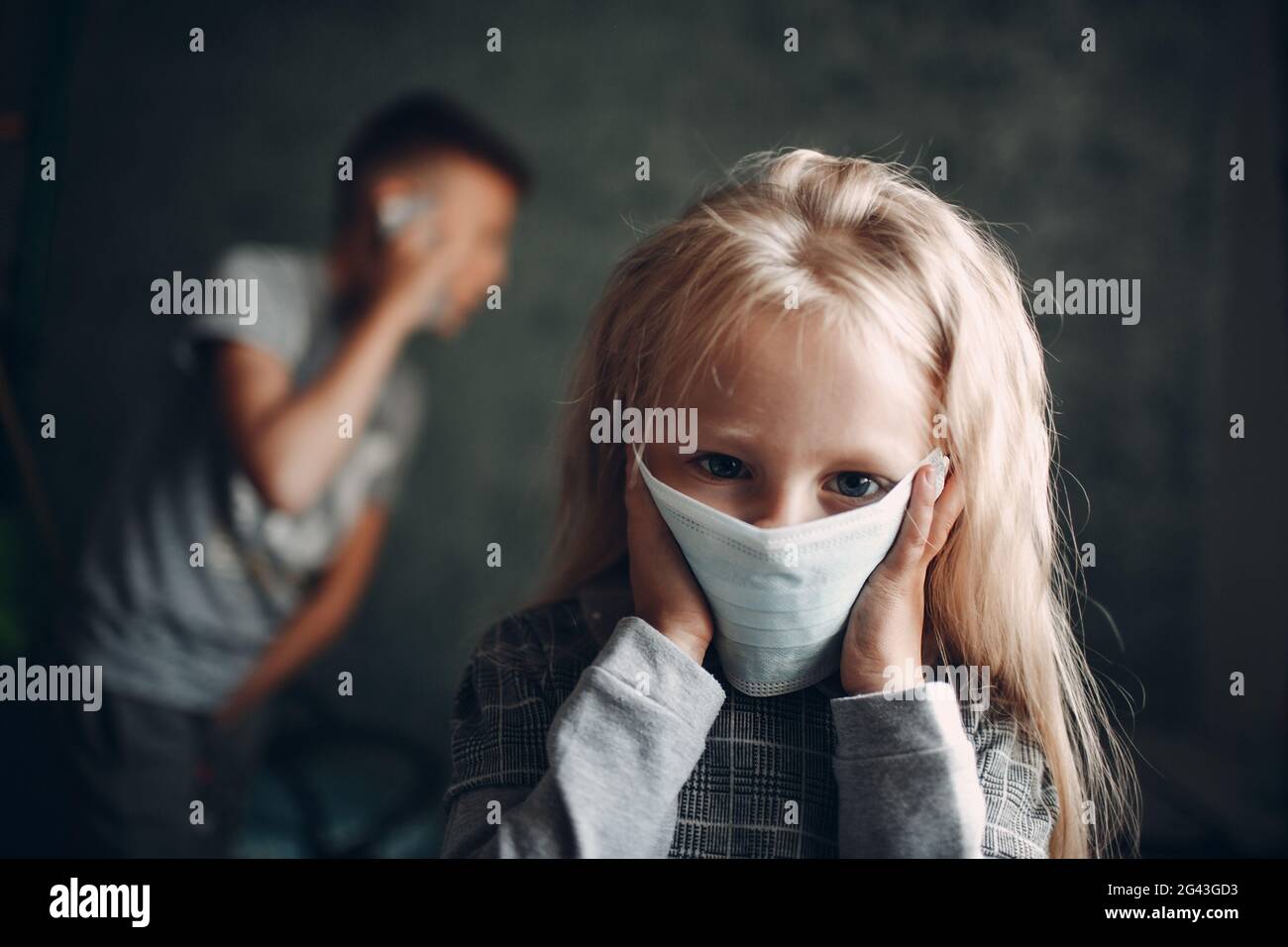 Portrait of little girl wearing medical face mask, virus protection concept. Stock Photo
