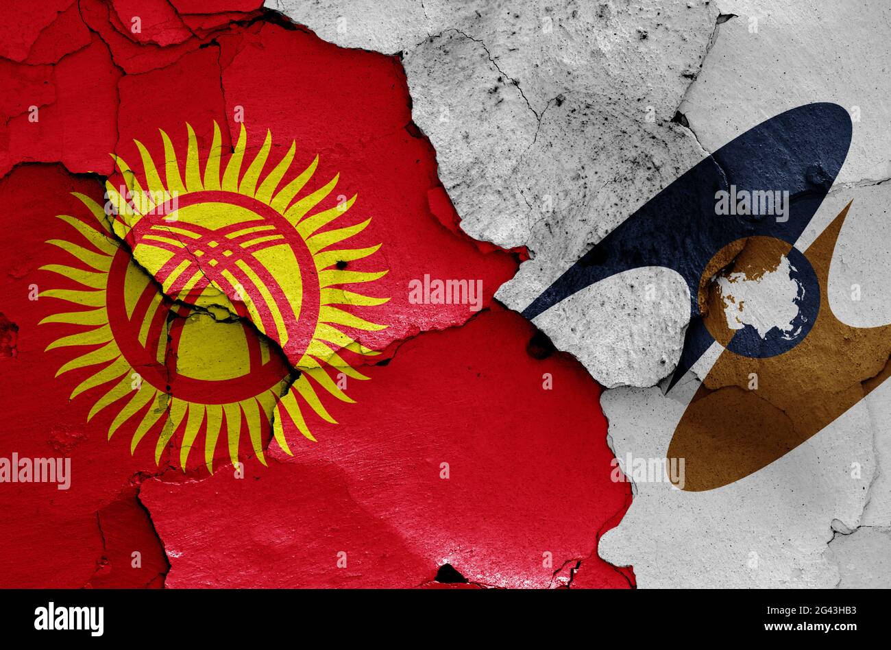 Flags of Kyrgyzstan and Eurasian Economic Union painted on cracked wall Stock Photo