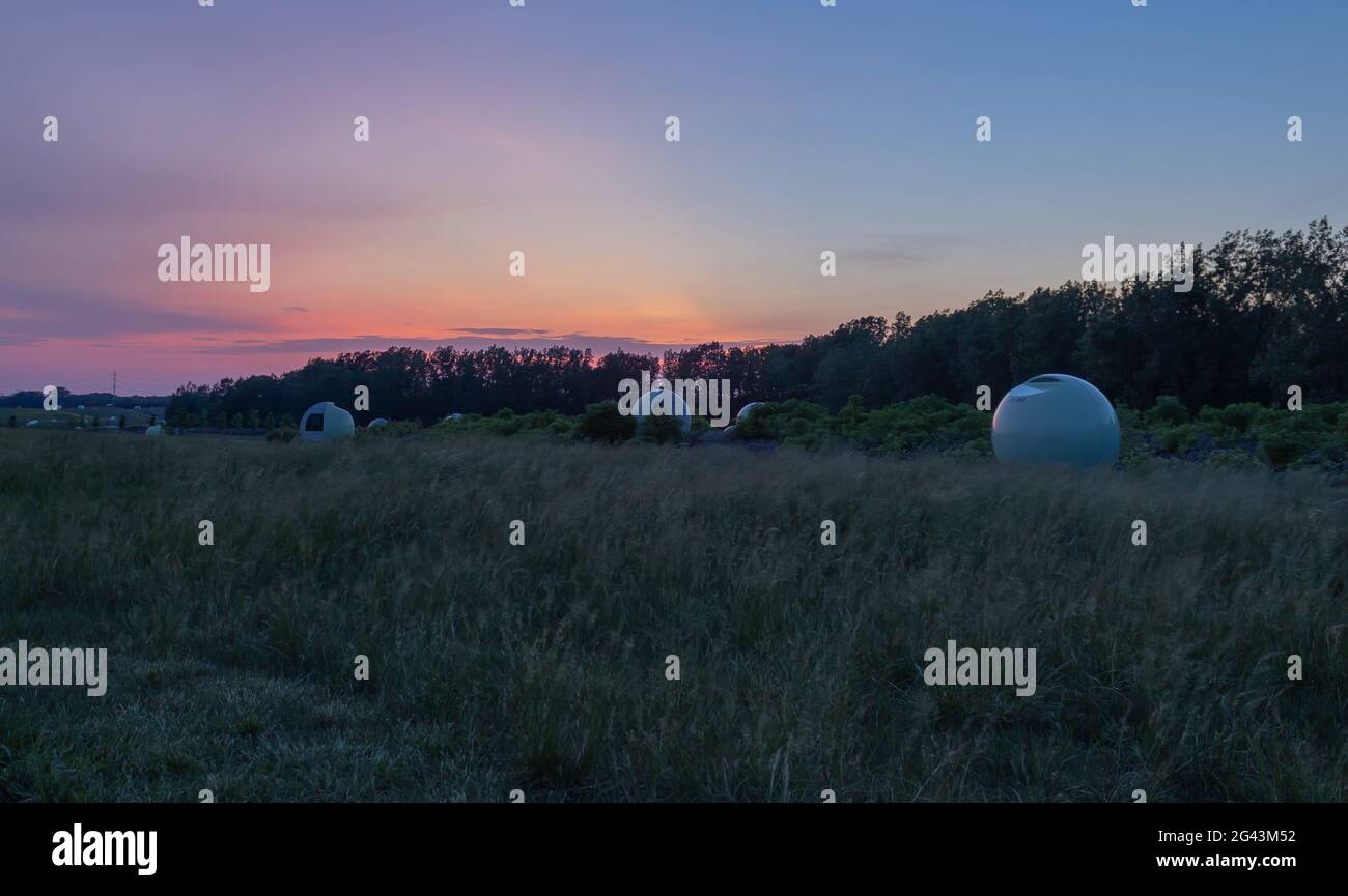 Beautiful sunset at Frédéric-Back park. You can find many glow in the dark biogas spheres. Stock Photo