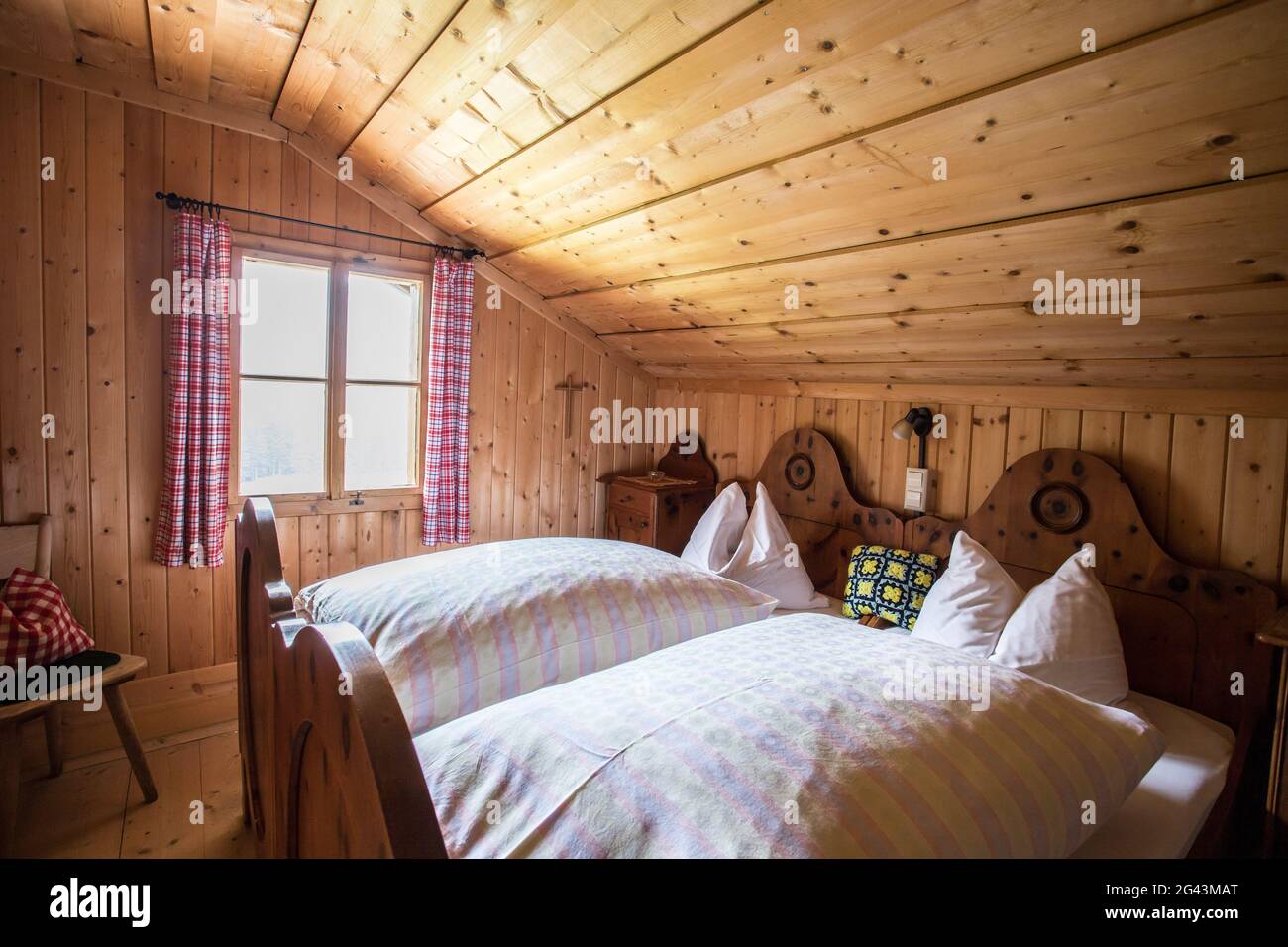 Holiday in the mountains: Rustic old wooden interior of a cabin or alpine hut Stock Photo