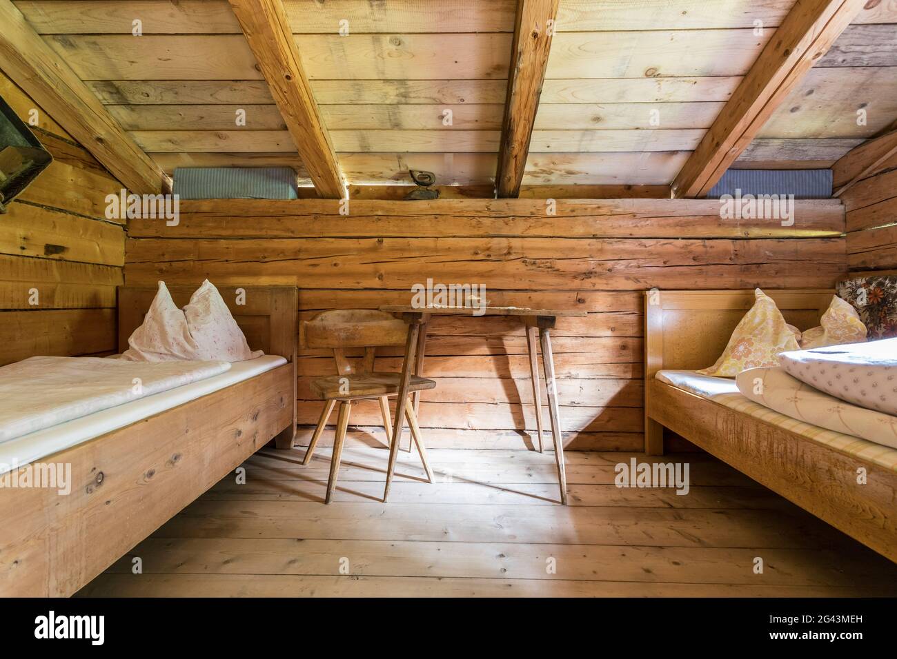 Holiday in the mountains: Rustic old wooden interior of a cabin or alpine hut Stock Photo